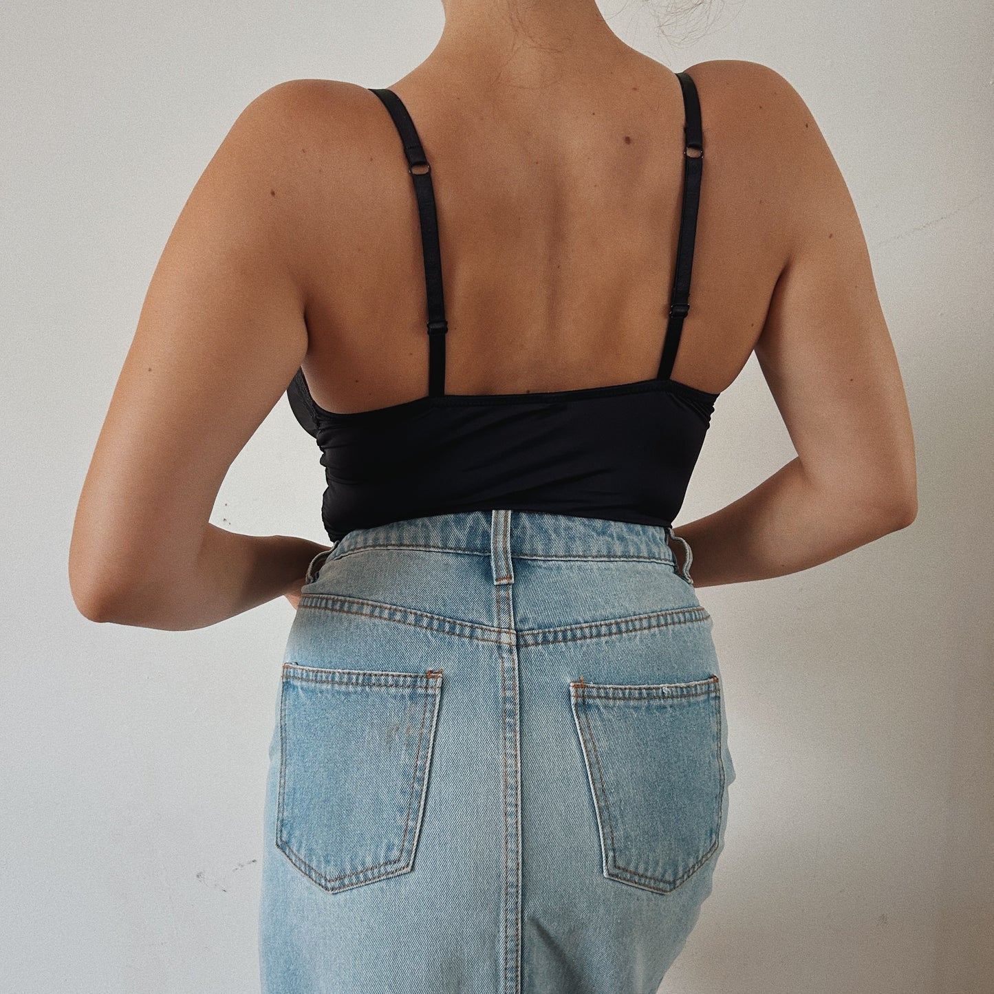 Stretchy black bodysuit with lace details